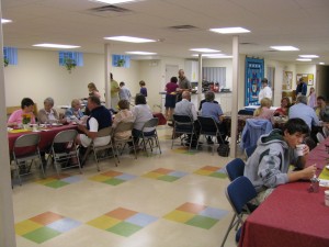 After breakfast adults enjoy learning and discussion over coffee.