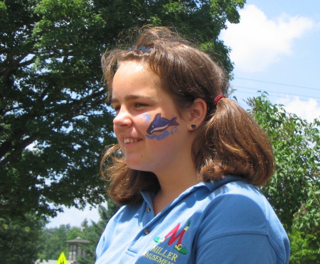 Kathleen Kenyon offered face painting at our booth after the parade.